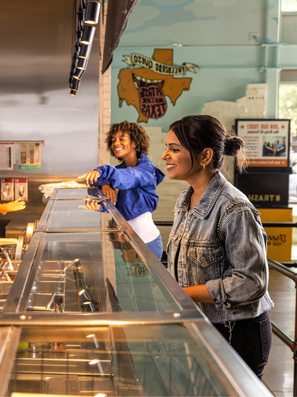 Customers ordering food in line at Freebirds